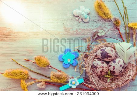 Easter Background With Easter Eggs, Pussy-willow And Spring Flowers. Top View With Copy Space