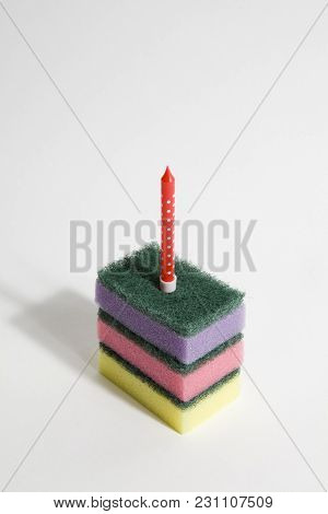 A Pile Of Multicolored Sponges With A Candle Symbolizing A Piece Of Birthday Cake. Pop Minimal Color