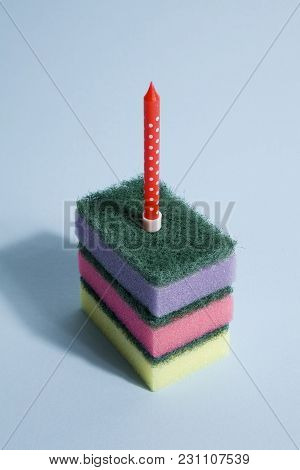 A Pile Of Multicolored Sponges With A Candle Symbolizing A Piece Of Birthday Cake. Pop Minimal Color