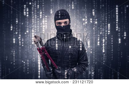 Burglar in action with encoded concept and his tools in his hand. 