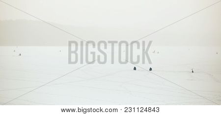 Belarus, Grodno, Molochnoe Lake. Winter Fishing Fishermen On Ice