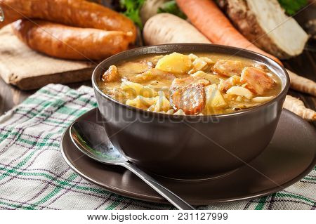 Traditional Polish Split Pea Soup With Sausage, Bacon And Potatoes