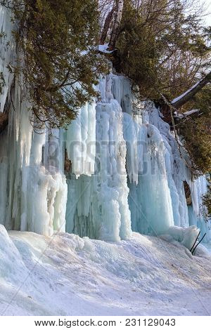 Ice Caves And Ice Curtains Form Along The Pictured Rocks Escarpment On Sand Point Road In Munising M