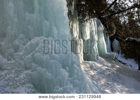 Ice Caves And Ice Curtains Form Along The Pictured Rocks Escarpment On Sand Point Road In Munising M