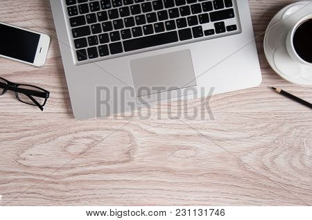 Laptop And Coffee Cup On Wood Table