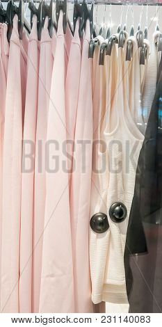 Black Security Tags Or Sensors On Clothing In Store