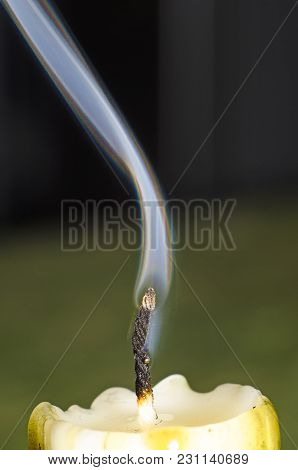 Closeup With A Rainbow On The Edge Of The Smoke From A Lighted Candle