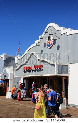 Santa Monica, United States - April 6, 2014: People Visit The Pier In Santa Monica, California. As O
