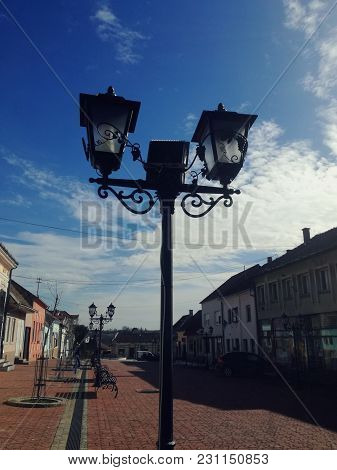 Street Lamp, City And Blue Sky With Clouds. Detail Fro Small Town In Serbia, Irig. Vintage Retro Lam