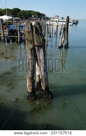 VENICE, ITALY - MAY 28 : Wooden mooring poles in the sea on the way from Lido di Jesolo to Venice, Italy, on May 28, 2017.