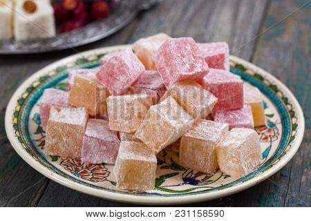 Rahat Lokum - Turkish Delight With Powdered Sugar On A Wooden Background