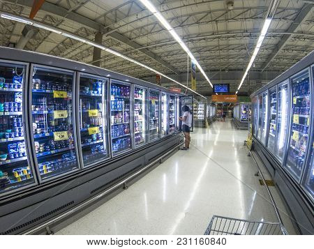Sao Paulo, Brazil ,, February 25, 2018. People Choose Products In Frozen Food Refrigerator In A Supe