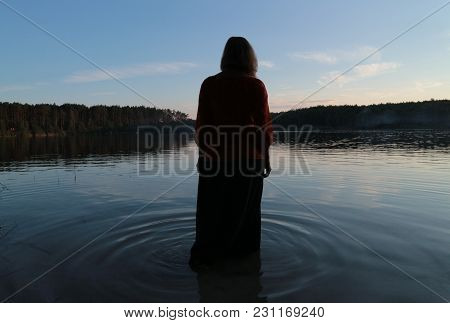 A Girl In The Waters Of The Forest Lake