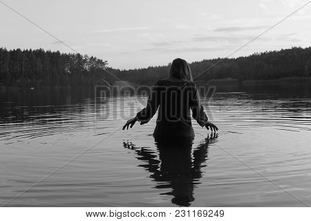 A Girl In The Waters Of The Forest Lake