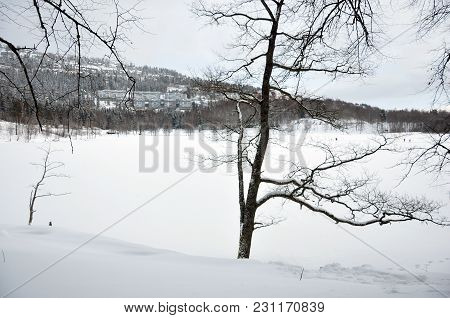 Snowy Lake Bogstadvannet With Houses Voksenlia On The Hillside.