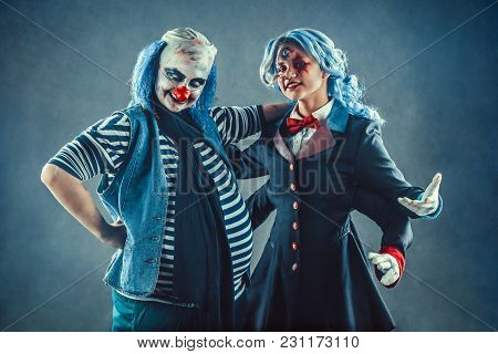 The Troupe Of Mad Circus Actors On The Studio Background.