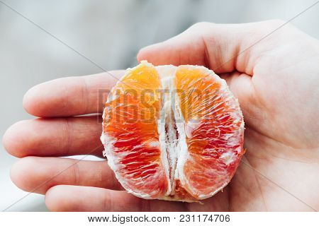 Half Of The Red Orange Lies On The Arm