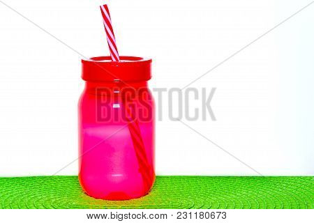 Plastic Bottle Of Raspberry Drink Isolated On White Background.