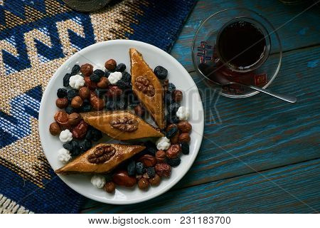Azerbaijan National Pastry Pakhlava With Sweet Snack And Glass Of Traditional Black Tea On Wooden Ta