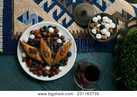 Azerbaijan National Pastry Pakhlava With Sweet Snack And Glass Of Traditional Black Tea On Wooden Ta