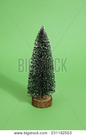 Isolated Full Artificial Christmas Tree On A White Background. Minimal Still Life Photography
