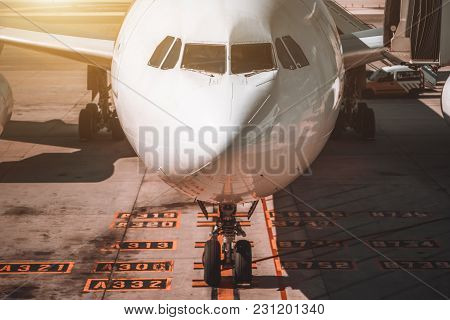Front View Of Nose And Cabin Of Just Arrived Airplane: White Fuselage With The Empty Flight Deck, Cl