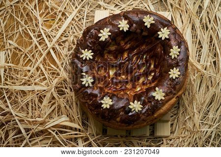 Traditional Ukrainian Wedding Bread Korovai Or Karavai With Decorations On Rustic Straw Background.