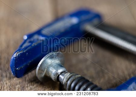 Carpenter's Clamp For Carpentry Work. Accessories In A Carpentry Workshop For Furniture Construction