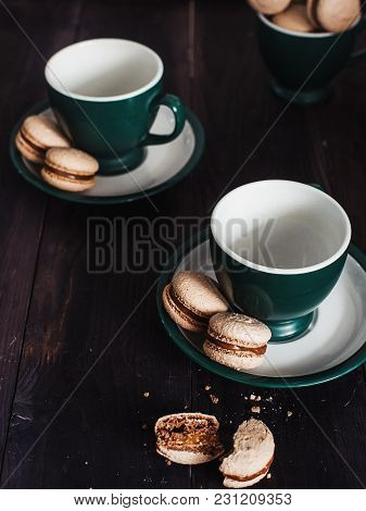 Many Delicious  Makaroons  In A Green Mug. Dark Style