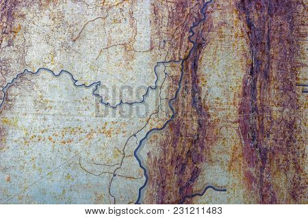 Metallic Rusted Painted Surface With Corrosion And Blue Lines As Texture Or Background. Thin Metal P