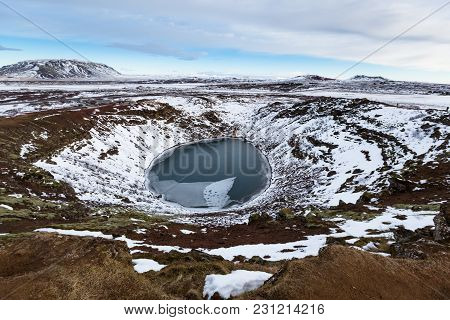 Volcanic Crator In Winter Under Cloudy Sky