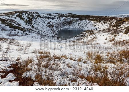 Volcanic Crator In Winter Under Cloudy Sky