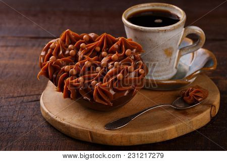 Chocolate Egg Ith Filling For Easter On Wooden Background