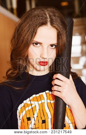 Portrait of attractive brown-haired woman indoors