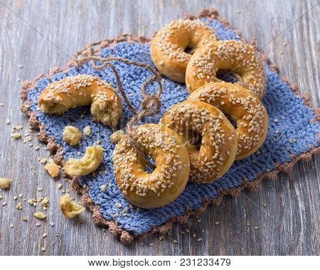 Traditional Greek Easter Biscuits Paskhalina Kuluria With Sesame Seeds On A Wooden Table, Selective 