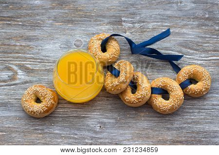 Traditional Greek Easter Biscuits Paskhalina Kuluria With Sesame Seeds On A Wooden Table, Selective 