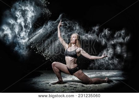 Girl Dansing With Flour During Photoshoot On Black Background