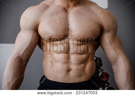 Brutal Strong Bodybuilder Athletic Men Pumping Up Muscles With Dumbbells