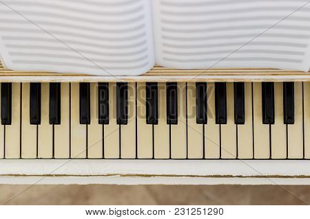 Piano Close-up, Musical Instrument. Learn To Play The Instrument At Home. White Large Piano. Piano K