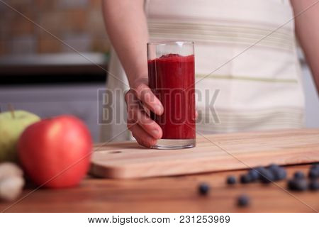 Girl Is Holding Glass Of Fresh Healthy Beet Smoothie