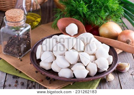 Homemade Raw Pelmeni Or Dumpling In A Plate. Traditional Russian Pelmeni