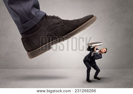 Young businessman illustrated inconsiderable by being trampled
