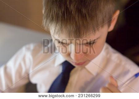 A Disgruntled Schoolchild Boy Thinks About Education