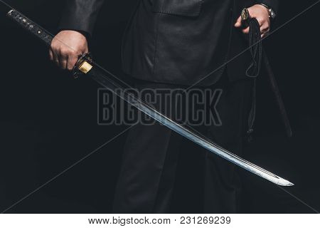 Cropped Shot Of Man With Katana Sword On Black Background