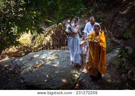KOH CHANG, THAILAND - MAR 10, 2018: During Christian sacrament of spiritual birth - Baptism. There are currently 10 Orthodox parishes in Thailand, Orthodoxy is practiced by 0.002% of population.