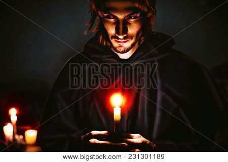 Warlock With A Candle In The Dark Scary Look