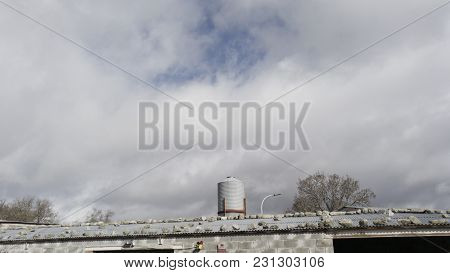 Roof Of Uralite With Stones To Protect From The Wind