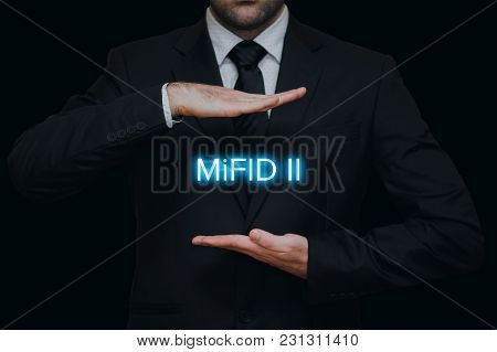 Markets In Financial Instruments Directive (mifid Ii) With Businessman Gesture On Black Background