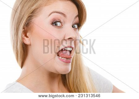 Fooling Around, Making Silly Faces Concept. Blonde Woman Having Tongue In Clothespin