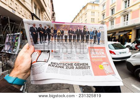 Paris, France - Mar 15, 2017: Man Reading Buying German Newspaper At Press Kiosk Featuring Angela Do